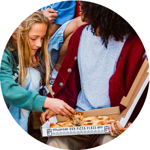 Youth Enjoying Fresh Pizza from Pizza Food Truck at a local event
